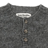 Close-up of Tom Beckbe Albemarle Henley Sweater, gray wool with three buttons, made in Scotland.