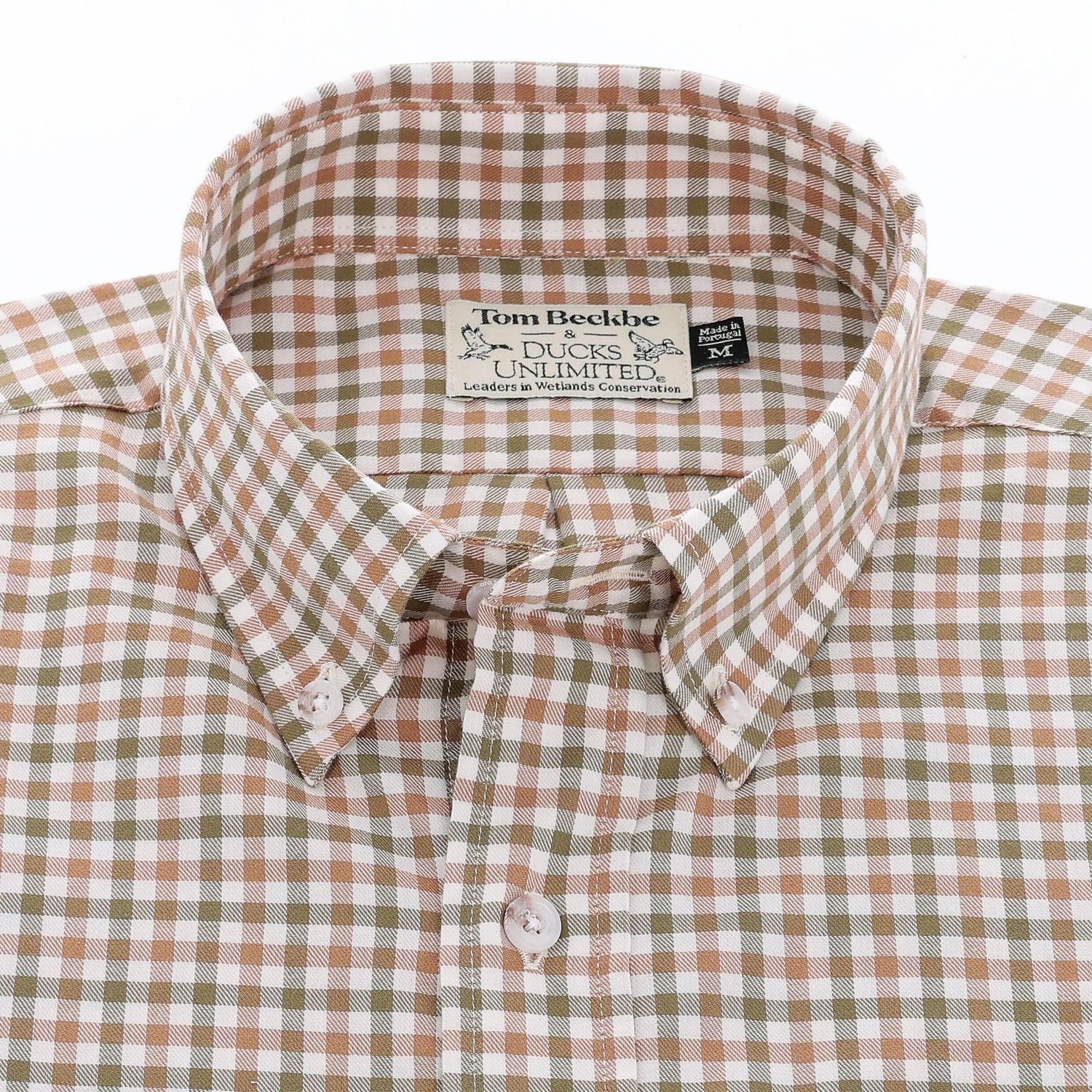 A brown, tan, and white plaid button-down shirt with a visible collar and brand label inside the neck.