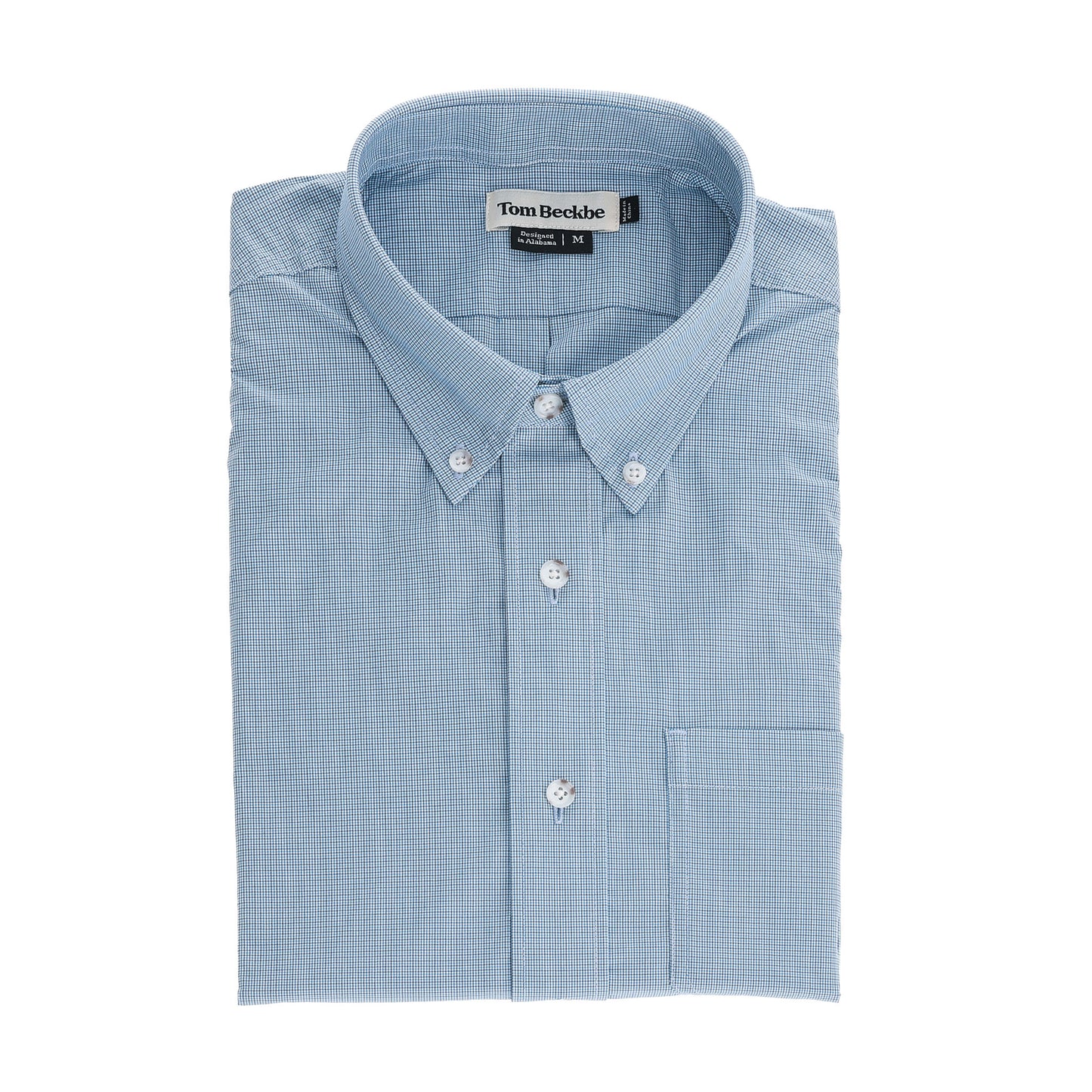 A neatly folded light blue Tom Beckbe Powell Performance Shirt, featuring the visible brand label.