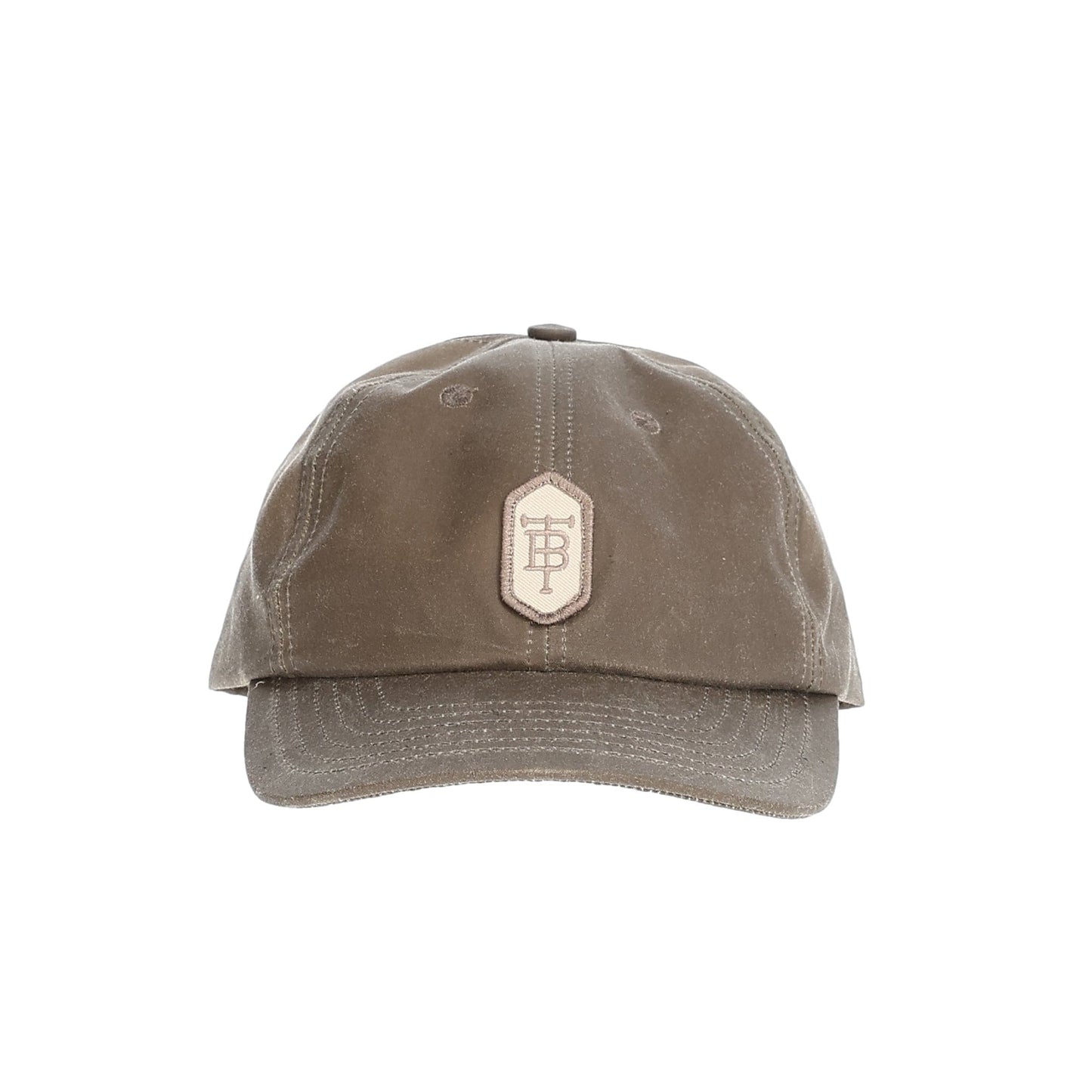 Tom Beckbes Waxed Cotton 6-Panel Baseball Hat features a front patch logo and full-grain leather strap.