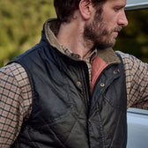 A man in the Tom Beckbe Dixon Brushed Cotton Twill Shirt stands outdoors by a white vehicle, looking to the side.