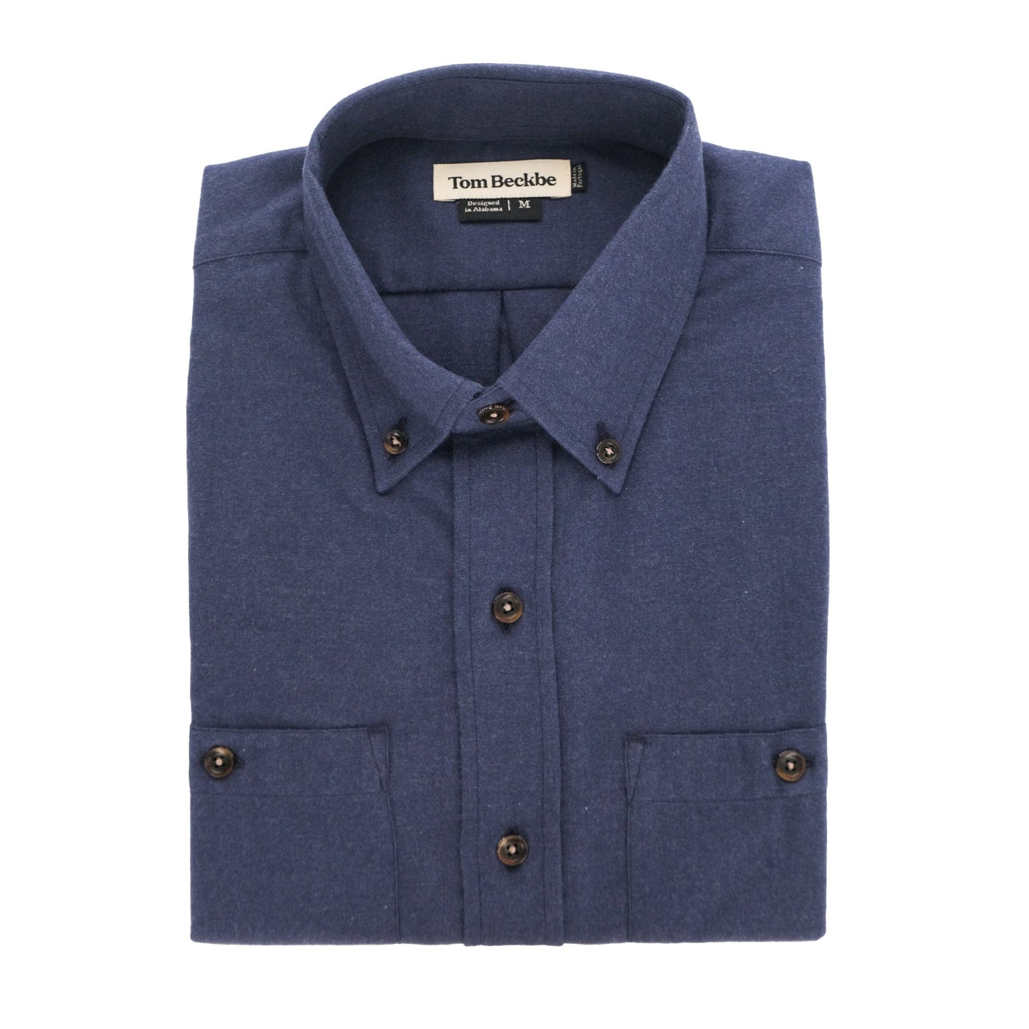 A folded Dixon Brushed Cotton Twill Shirt by Tom Beckbe, medium-weight, blue, long-sleeve, with buttoned cuffs.