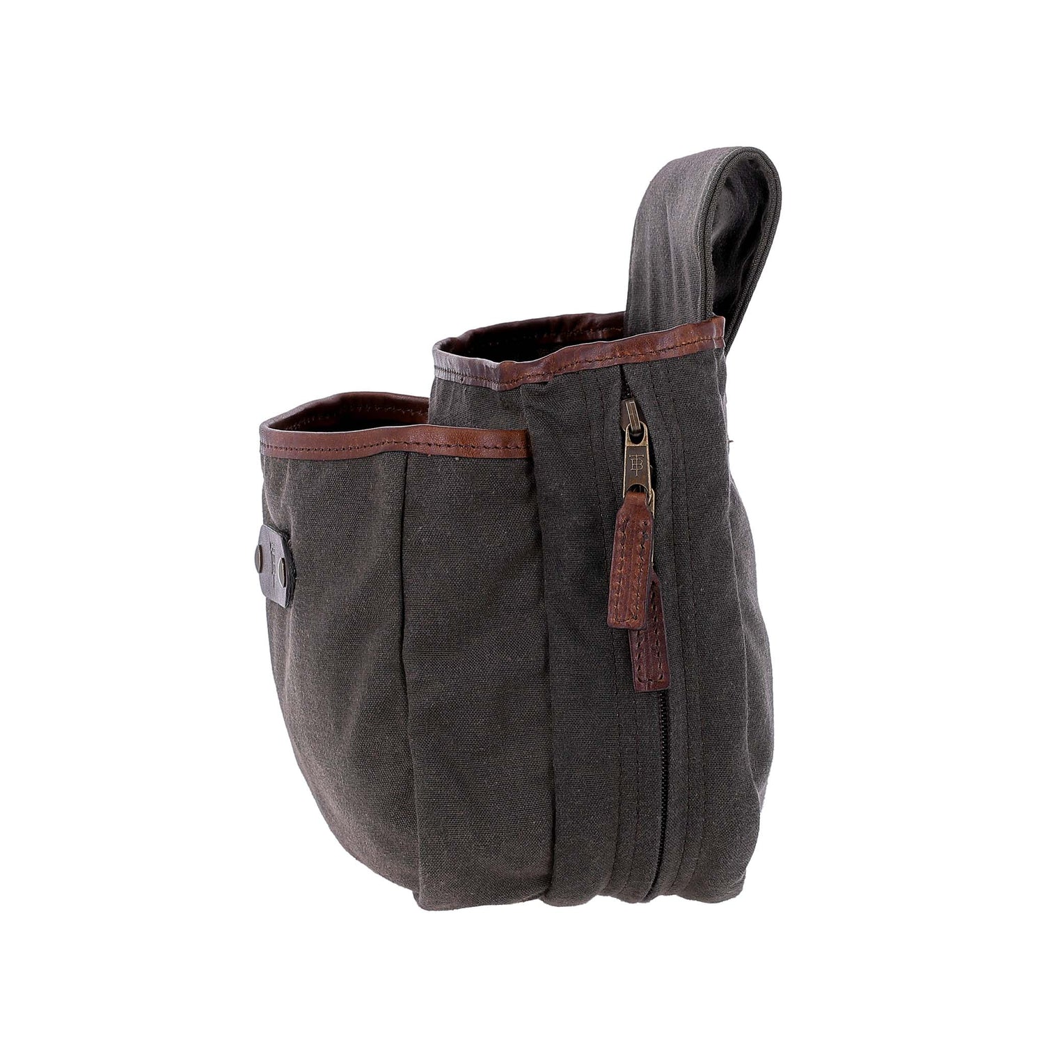 Side view of the Tom Beckbe Canvas Shell Bag: dark waxed canvas, brown leather trim, zipper closure, and loop handle.