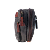 Side view of a Tom Beckbe Canvas Hanging Toiletry Bag in dark gray with brown leather accents and a side pocket.