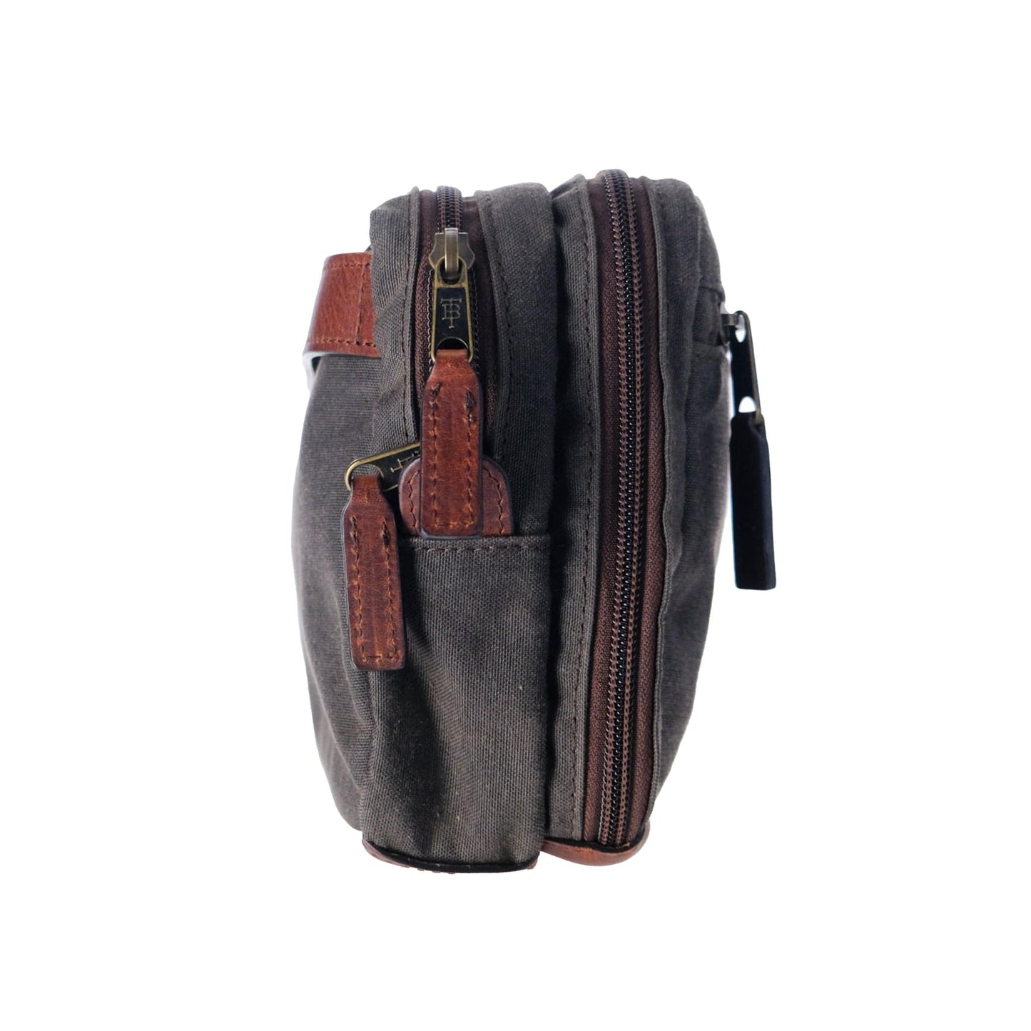 Side view of a Tom Beckbe Canvas Hanging Toiletry Bag in dark gray with brown leather accents and a side pocket.