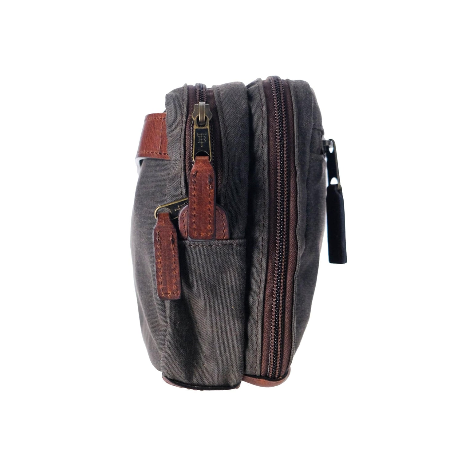 Side view of a Tom Beckbe Canvas Hanging Toiletry Bag in dark gray with brown leather accents and a side pocket.