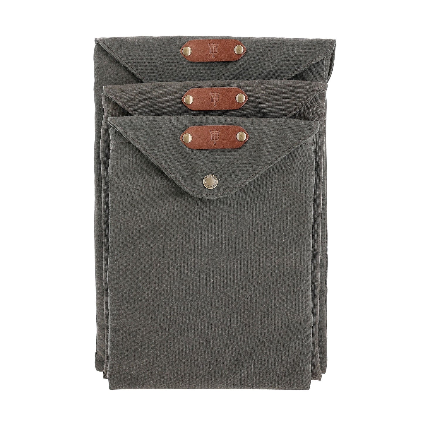 Three gray Canvas Portfolios by Tom Beckbe, weatherproof with leather tabs and snap closures, stacked together.