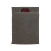 Weatherproof gray Canvas Portfolio by Tom Beckbe, featuring a brown leather accent for versatile tablet or laptop storage.