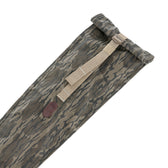 Tom Beckbe Canvas Roll Top Gun Sleeve in Mossy Oak Original Bottomland with tan adjustable strap on white background.