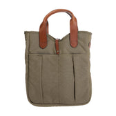 Tom Beckbe Canvas Whiskey Tote: olive green, leather handles, front pockets—ideal waxed canvas spirits carrier.