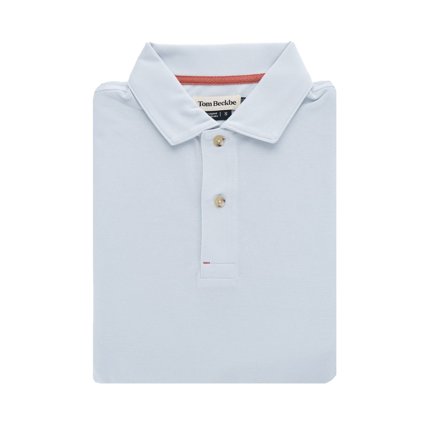 Folded Coastal Polo Shirt in light blue with buttons and a tag by Tom Beckbe against a plain background.