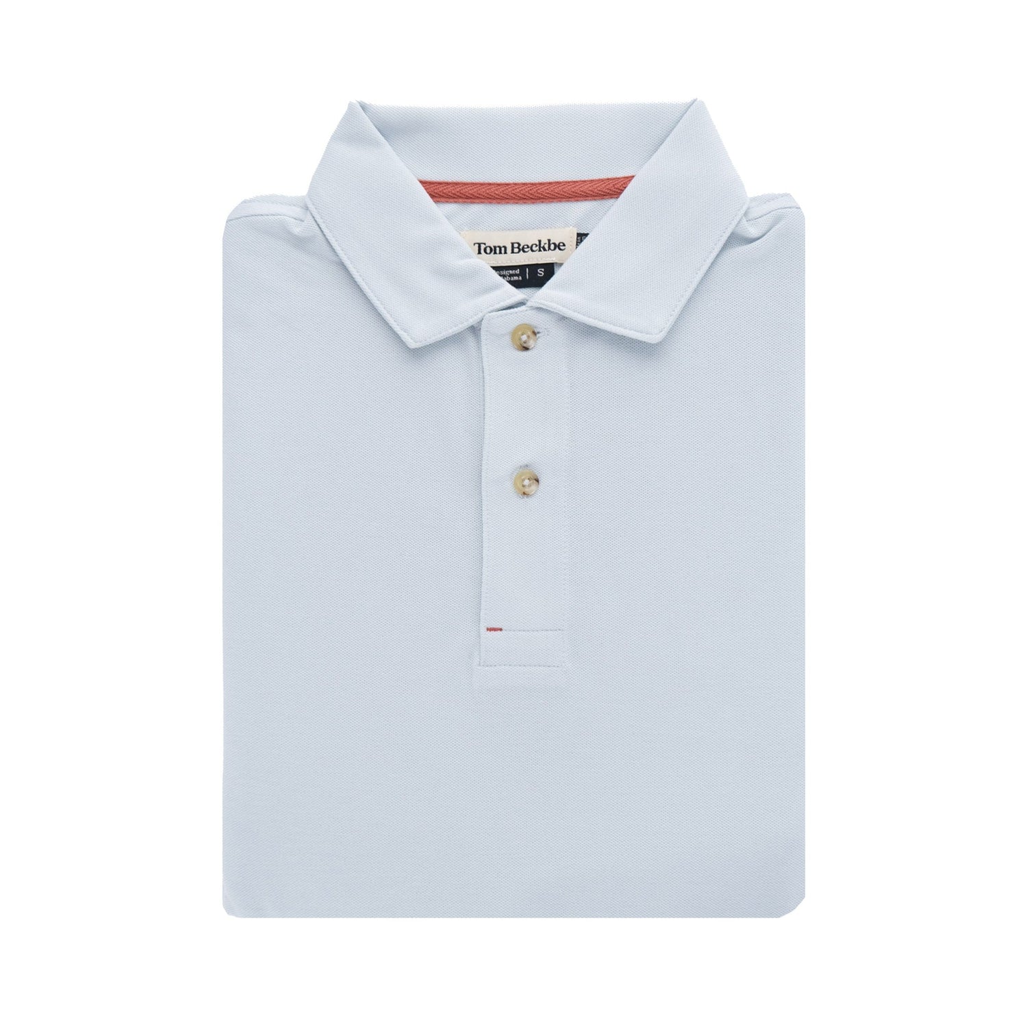Folded Coastal Polo Shirt in light blue with buttons and a tag by Tom Beckbe against a plain background.