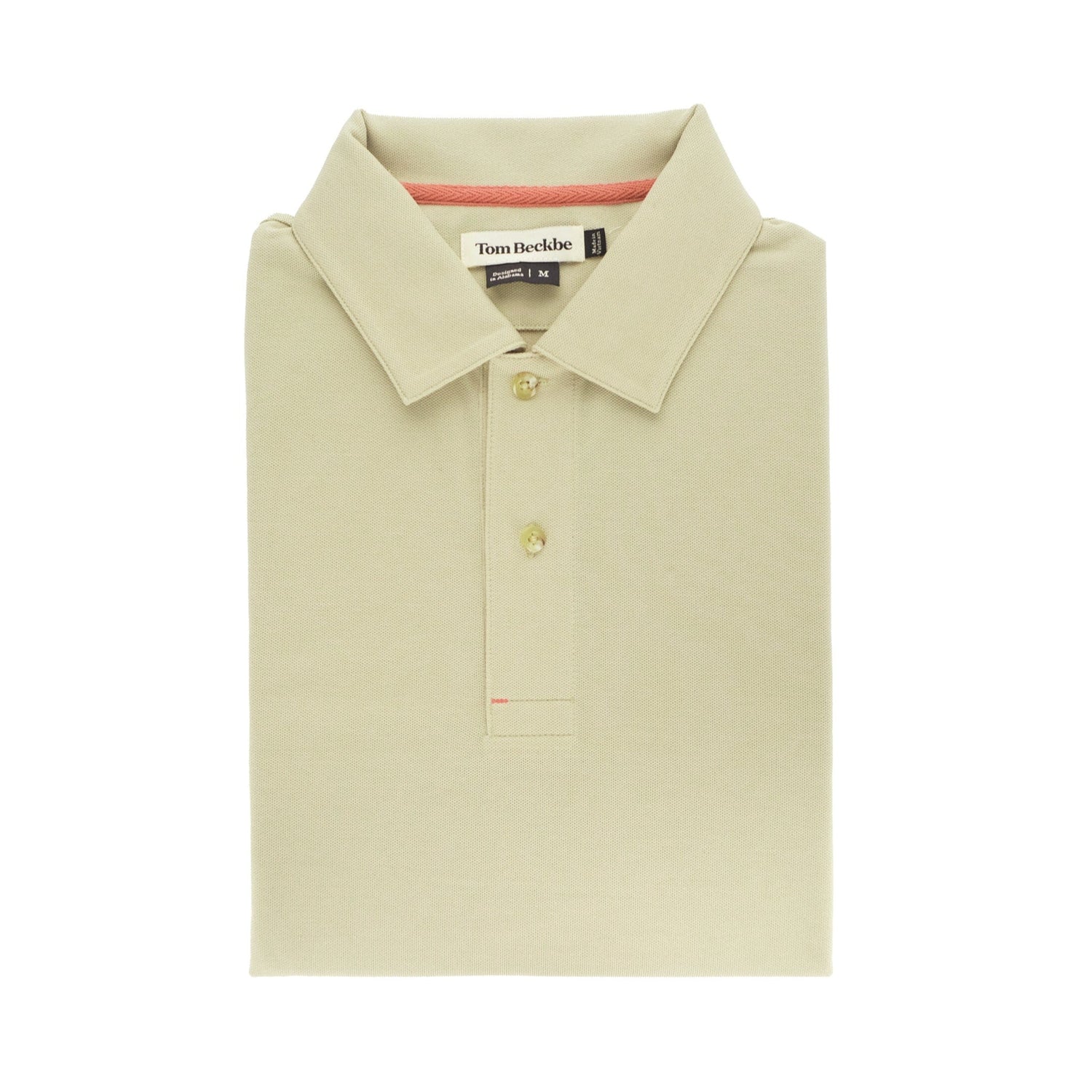 Folded beige Coastal Polo Shirt by Tom Beckbe, featuring a classic collar with two buttons and an interior sewn label.