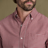Man wearing Tom Beckbe Culver Oxford Shirt in red and white check, shown shoulders to chin with a short beard.