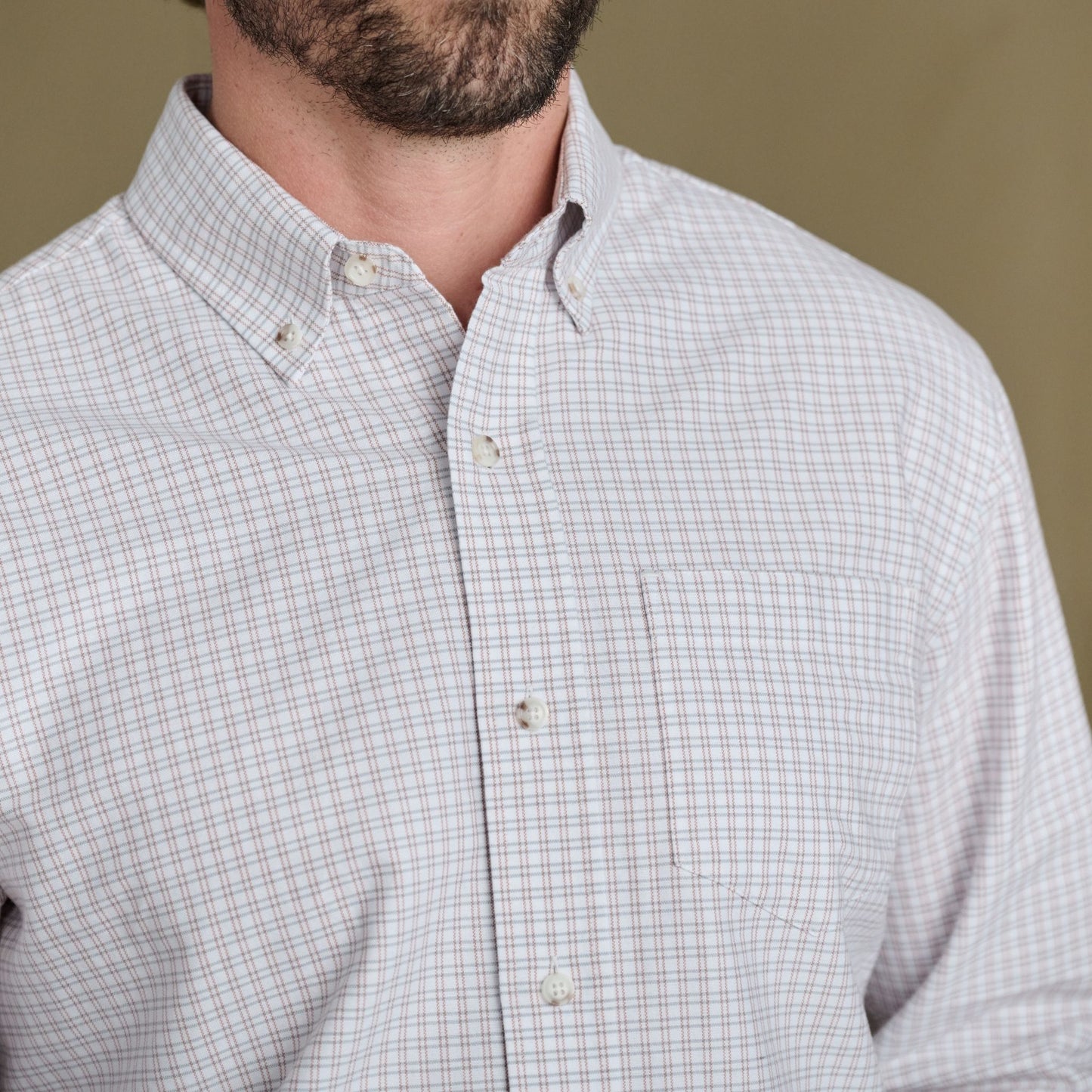 A man wears the Tom Beckbe Culver Oxford Shirt in breathable grid-pattern oxford, shown chest to chin.