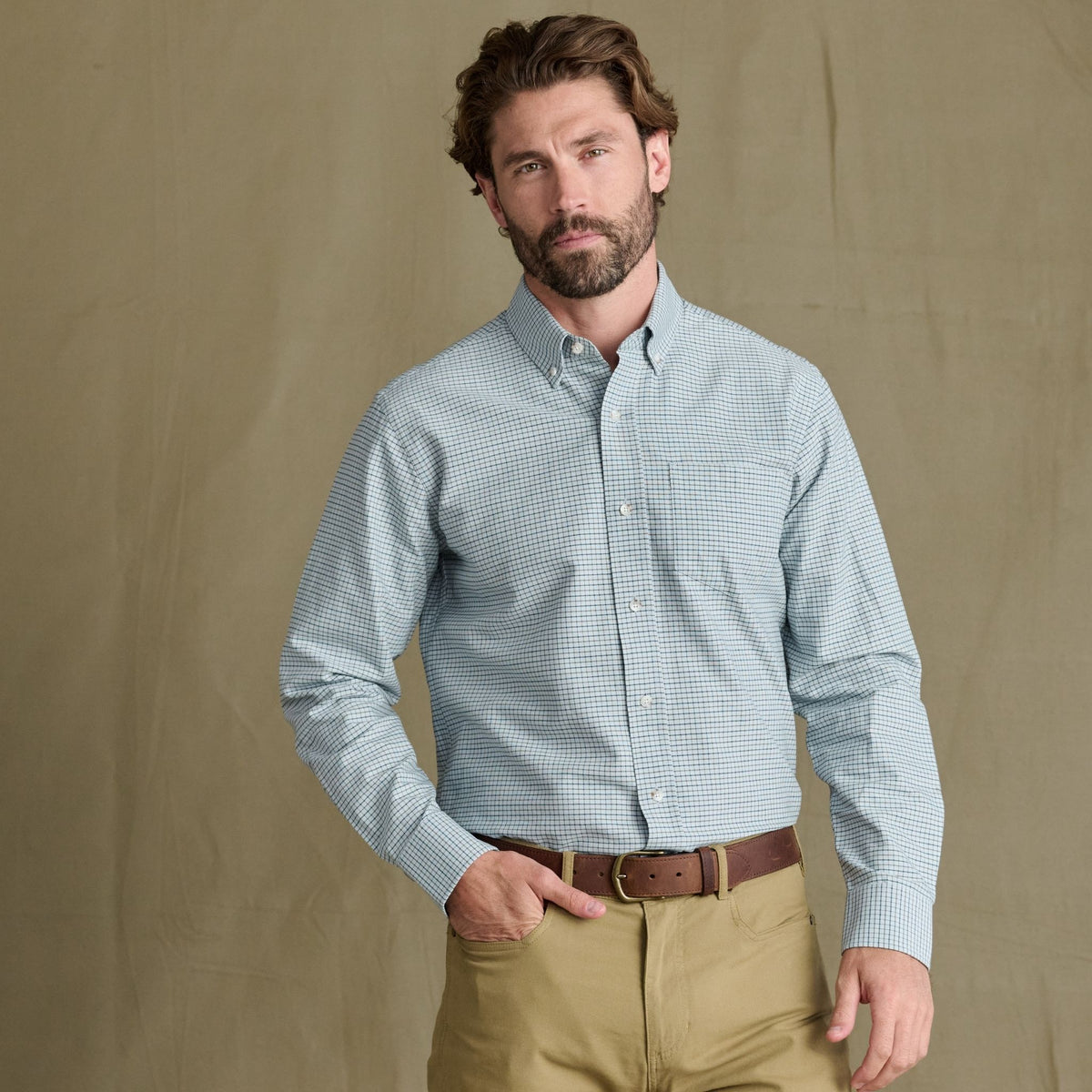 Man with brown hair and beard wears the Tom Beckbe Culver Oxford Shirt, standing against a plain background.