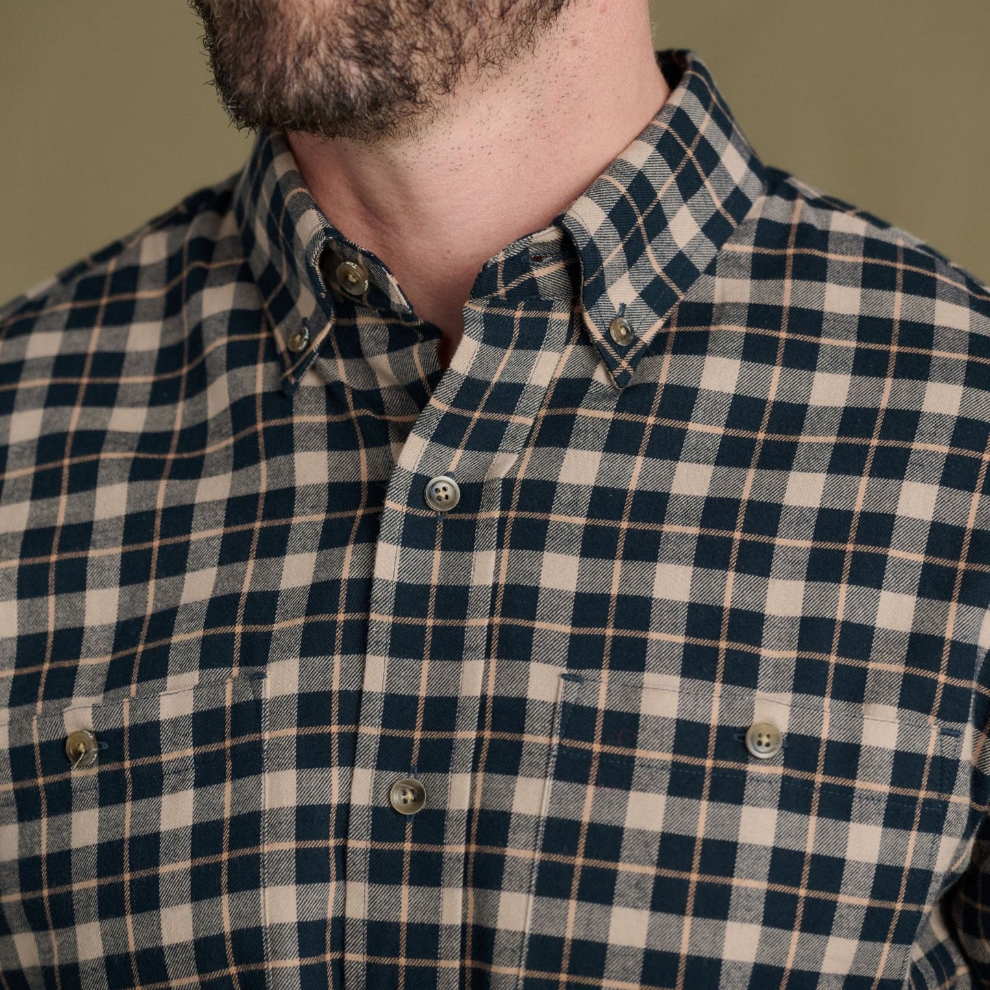 Close-up of a person in the Tom Beckbe Dixon Brushed Cotton Twill Shirt with ultrasoft cotton and chest pockets.