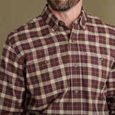 Man in a maroon and beige Tom Beckbe Dixon Brushed Cotton Twill Shirt with two chest pockets, shoulders to mid-torso.