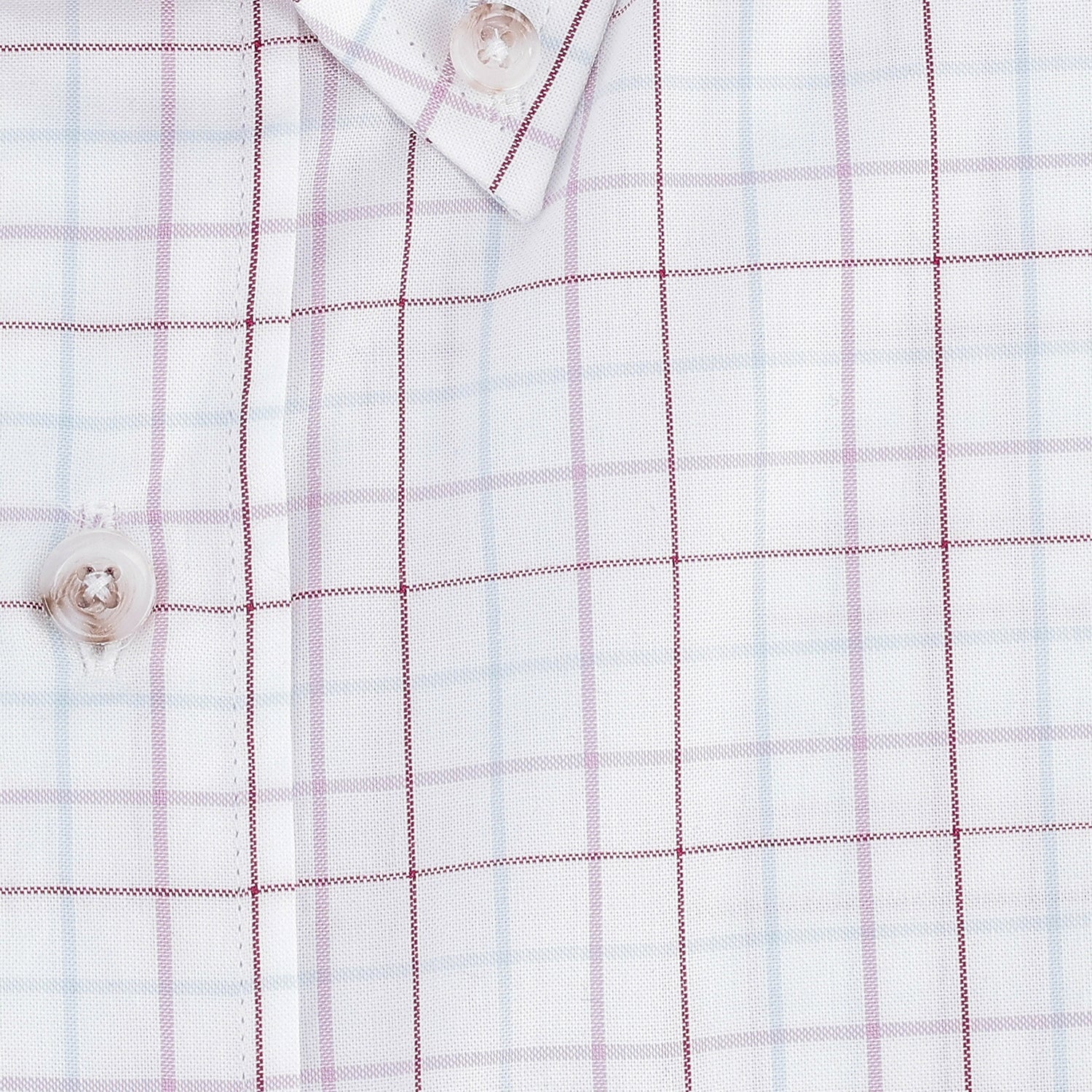 Close-up of the Tom Beckbe Ensley Pinpoint Oxford Shirt featuring a light blue and red grid and white buttons.