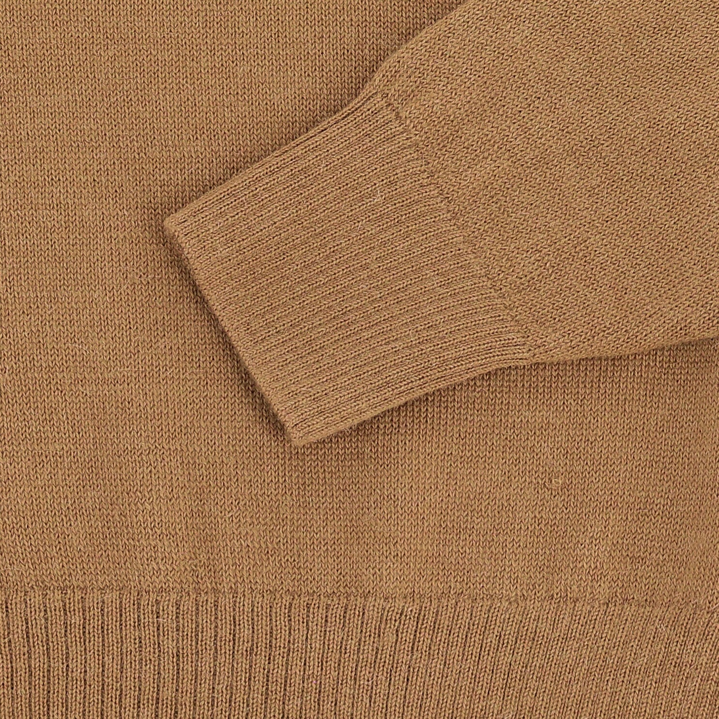 Close-up of the Henry Shawl Sweater in Royal Alpaca by Tom Beckbe, featuring a ribbed cuff and textured knit.