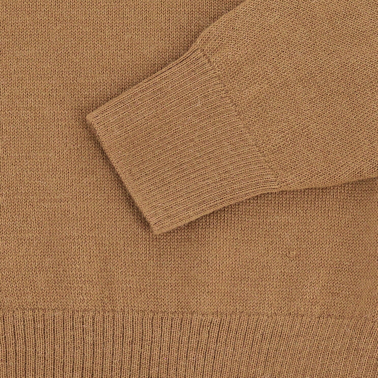 Close-up of the Henry Shawl Sweater in Royal Alpaca by Tom Beckbe, featuring a ribbed cuff and textured knit.