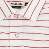 Close-up of the Tom Beckbe Hutton Performance Polo, men's, white with red stripes and buttons, made in Peru.