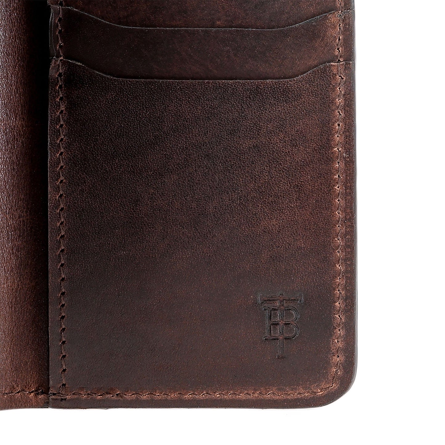 Close-up of the Tom Beckbe Leather Billfold featuring two card slots and embossed TB initials in the corner.
