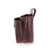 The Tom Beckbe Leather Shell Bag features multiple compartments and a zipper, shown upright on a white background.