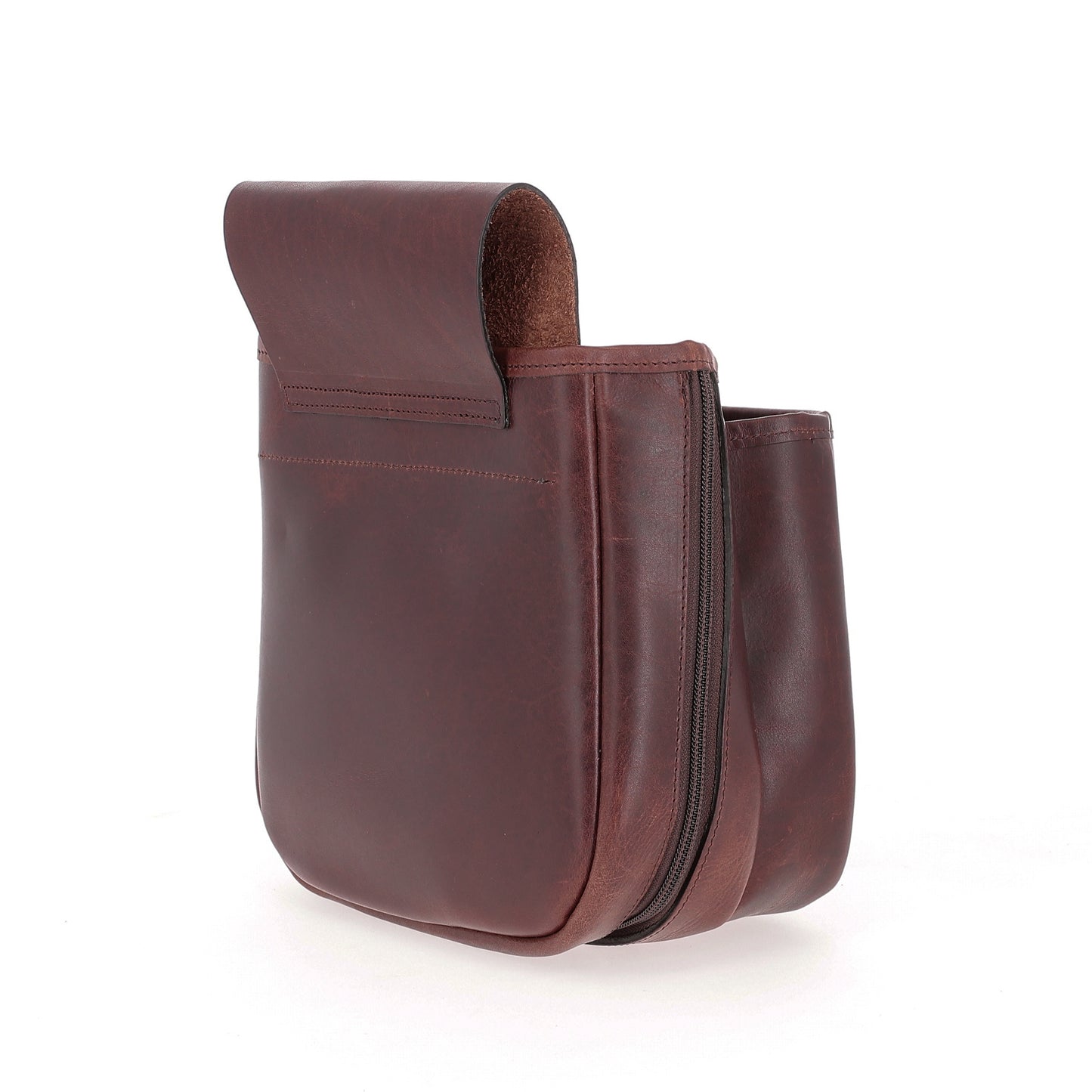 The Tom Beckbe Leather Shell Bag features brown full-grain leather, a fold-over flap, and side zipper on white background.