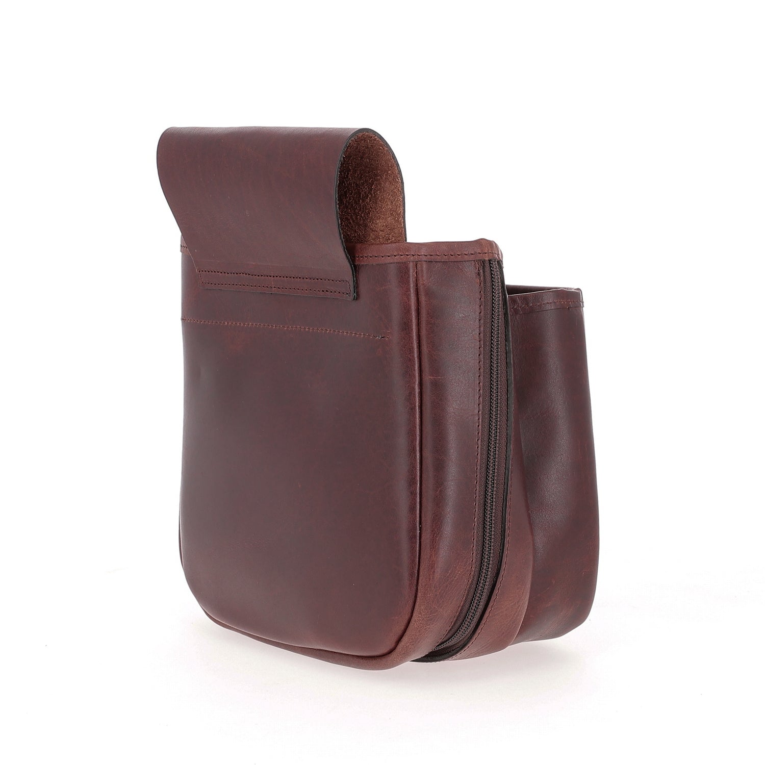 The Tom Beckbe Leather Shell Bag features brown full-grain leather, a fold-over flap, and side zipper on white background.