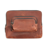 Tom Beckbe Leather Travel Pouch: brown full-grain leather with antique brass zippers, front pocket, and embossed initials.