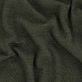 Close-up of the Tom Beckbe York Merino Quarter Zip in dark green, highlighting its soft texture and visible folds.