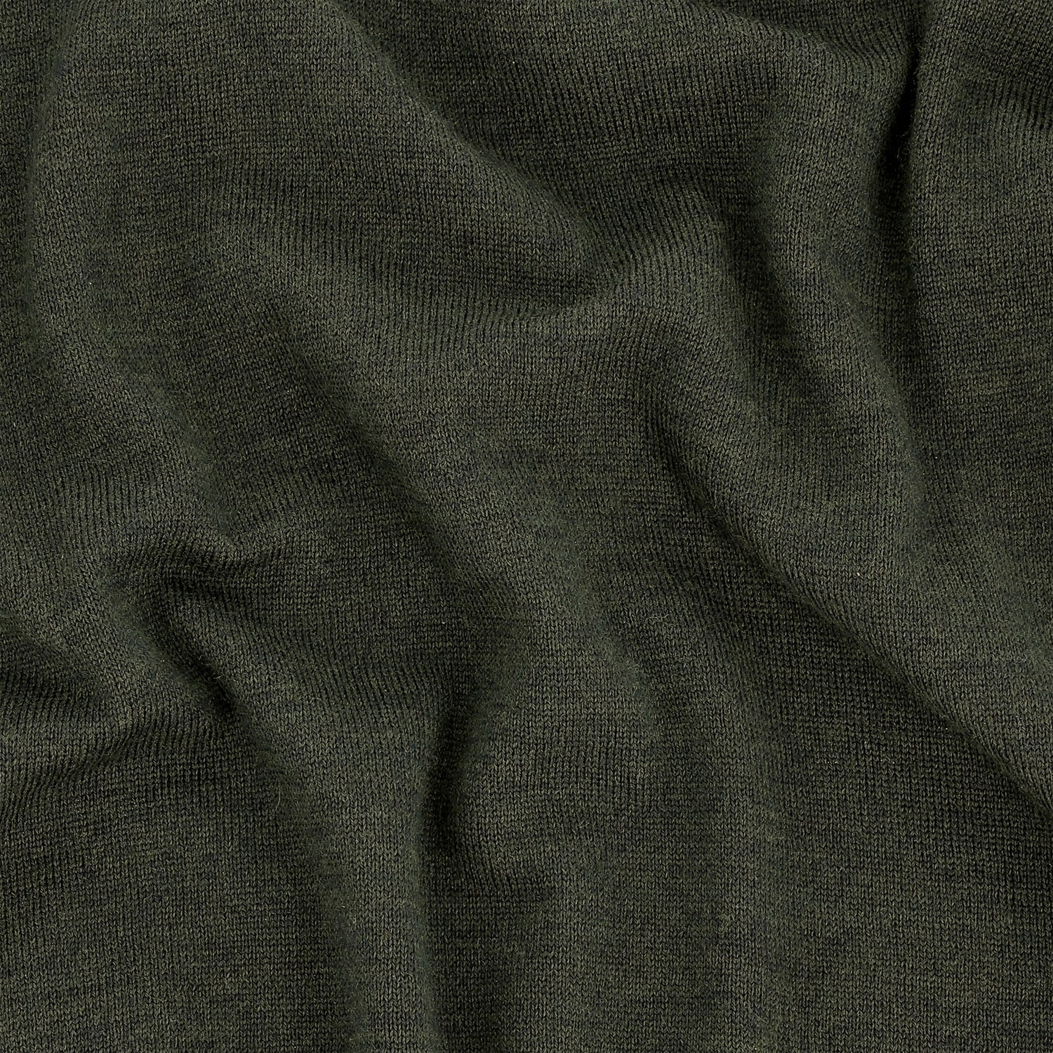Close-up of the Tom Beckbe York Merino Quarter Zip in dark green, highlighting its soft texture and visible folds.