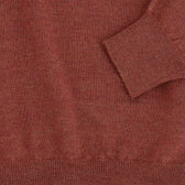 Close-up of the Tom Beckbe York Merino Quarter Zip in rust, made in Italy, showing cuff, hem, and fabric texture.