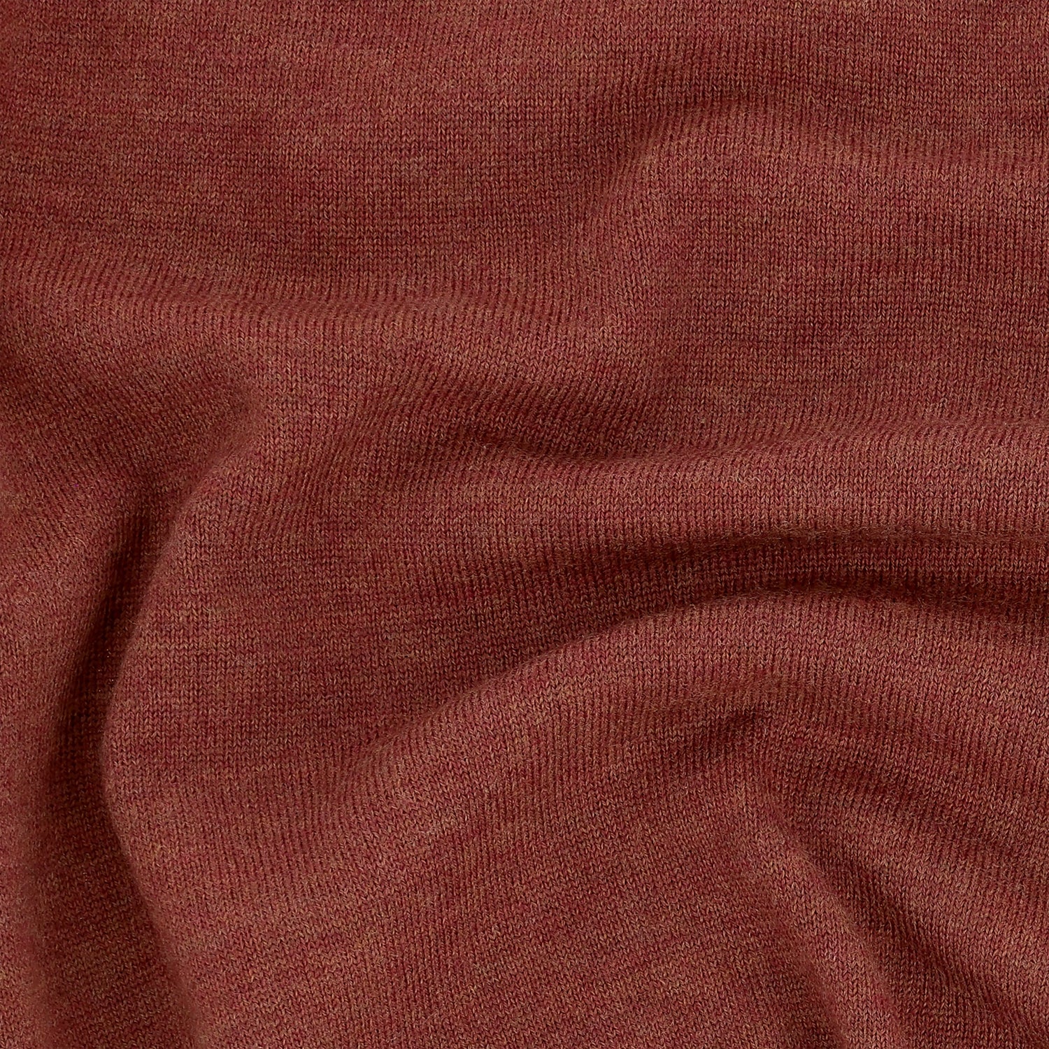 Close-up of the Tom Beckbe York Merino Quarter Zip sweater, showcasing its reddish-brown color and soft texture.