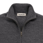 Close-up of a gray Tom Beckbe York Merino Quarter Zip sweater with a standing collar and inner label.