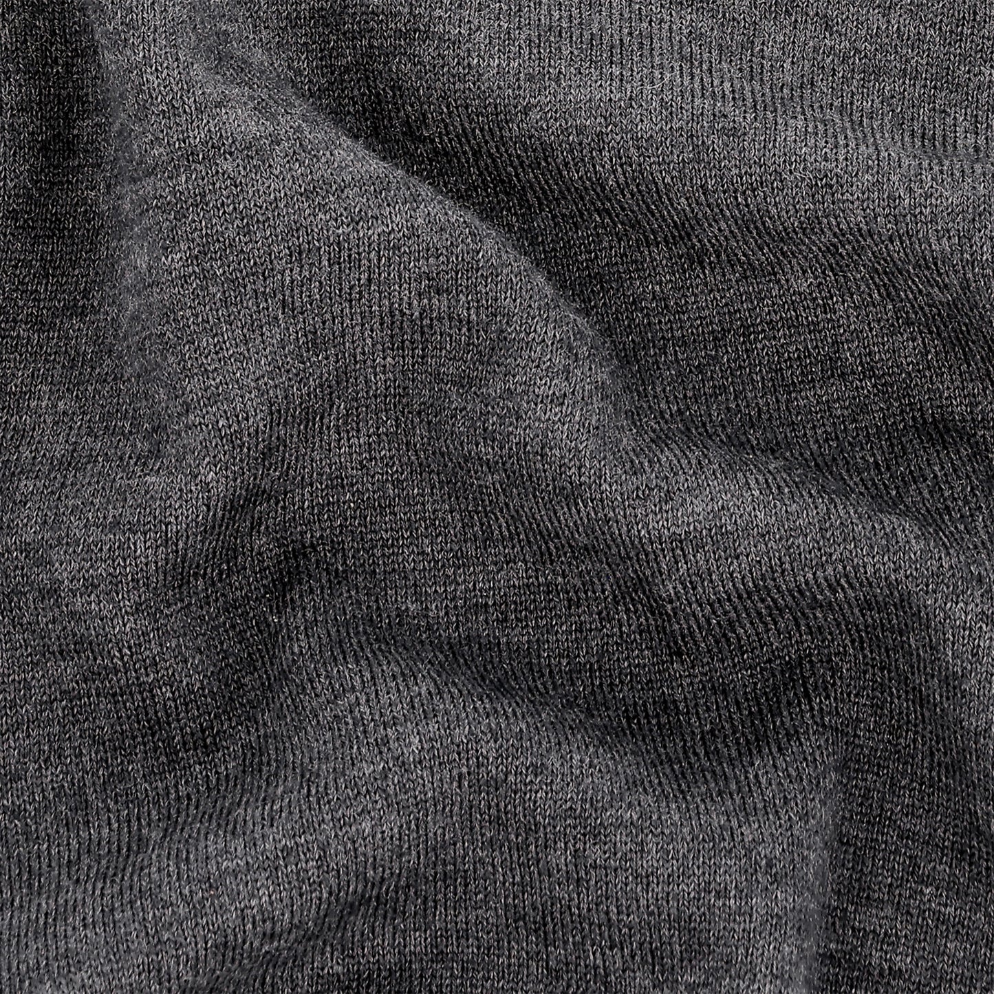 Close-up of the York Merino Quarter Zip by Tom Beckbe, showing its gray wool texture and subtle folds.