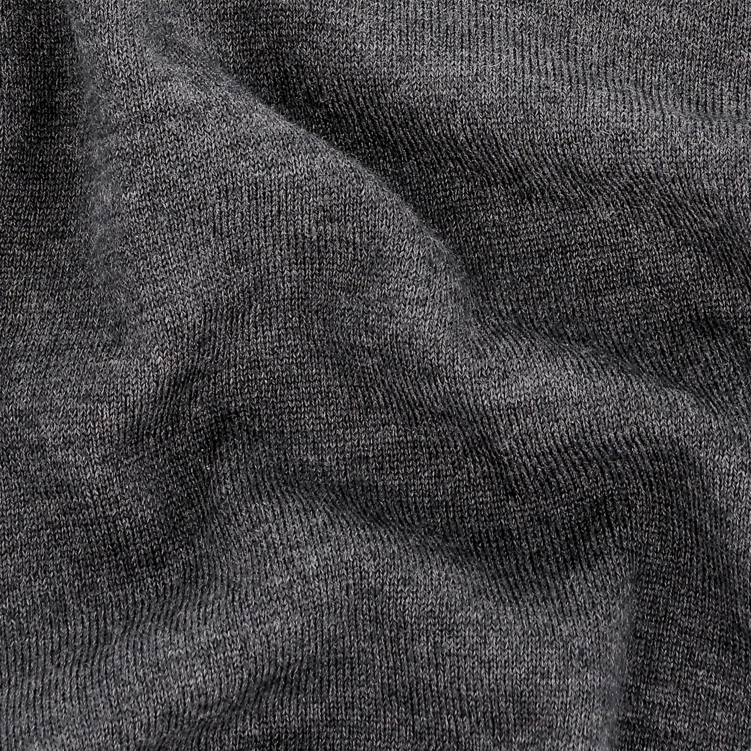 Close-up of the York Merino Quarter Zip by Tom Beckbe, showing its gray wool texture and subtle folds.
