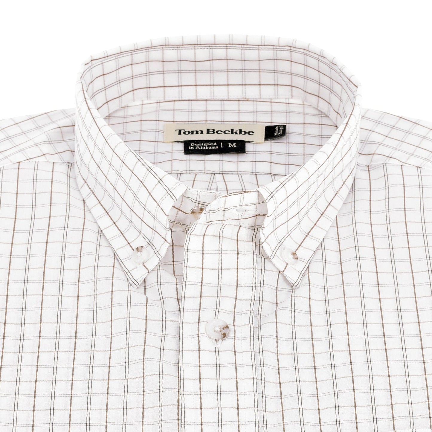 The Tom Beckbe Monroe Poplin Shirt, brown plaid cotton, is neatly folded on a white background.