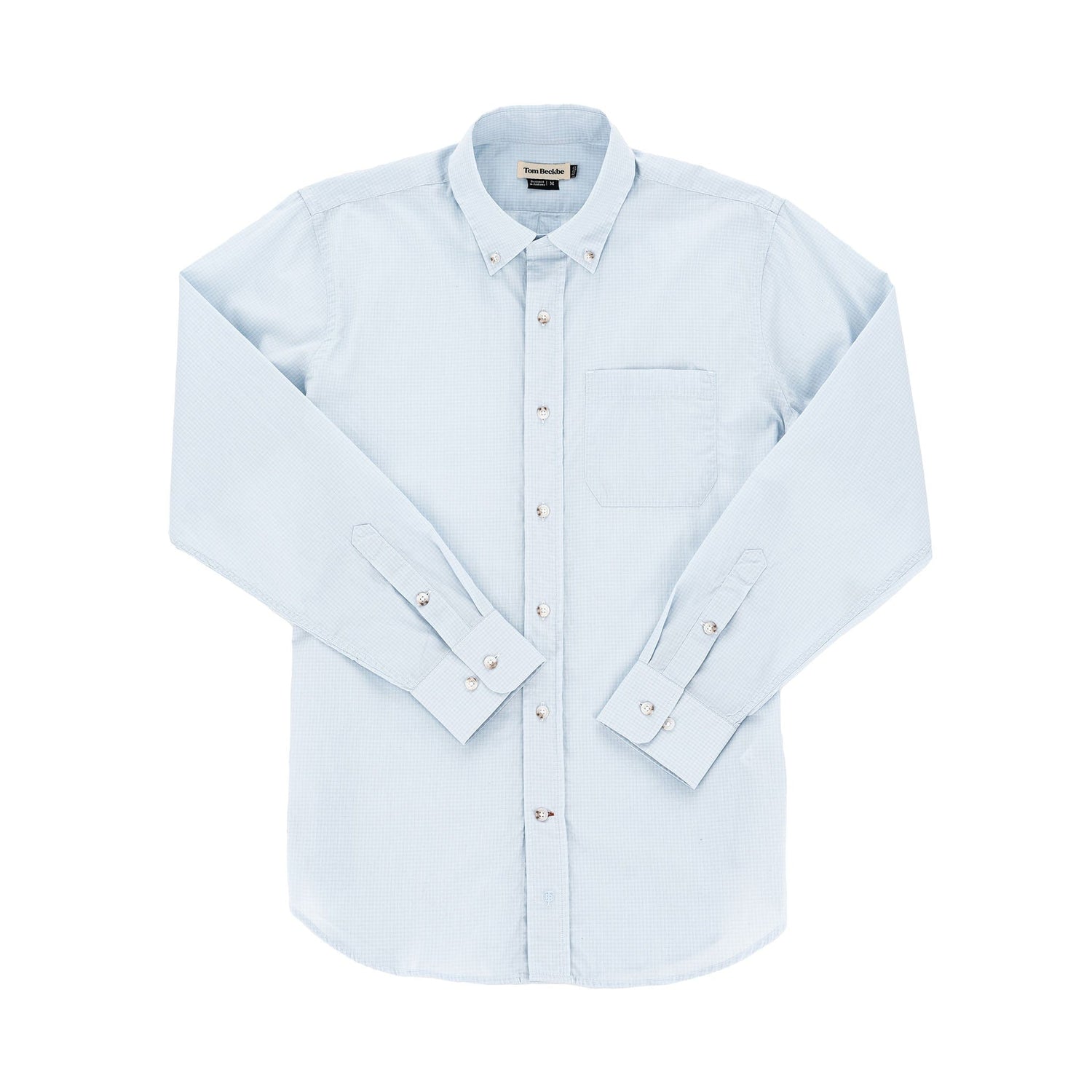 Tom Beckbes Monroe Poplin Shirt, light blue cotton with a chest pocket and long sleeves, slightly wrinkled on white.