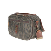 Tom Beckbe Canvas Blind Bag in Mossy Oak Original Bottomland with brown leather accents, front pocket, and luggage tag.