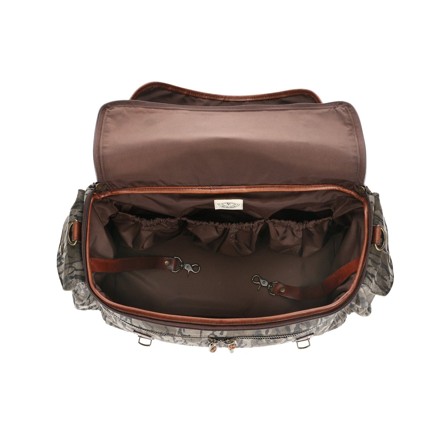 Top view of a Tom Beckbe Canvas Field Bag in Mossy Oak with inside pockets and clips on a white background.