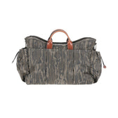 Tom Beckbes Canvas Utility Bag in Mossy Oak Original Bottomland has leather handles and zip pockets for field gear.