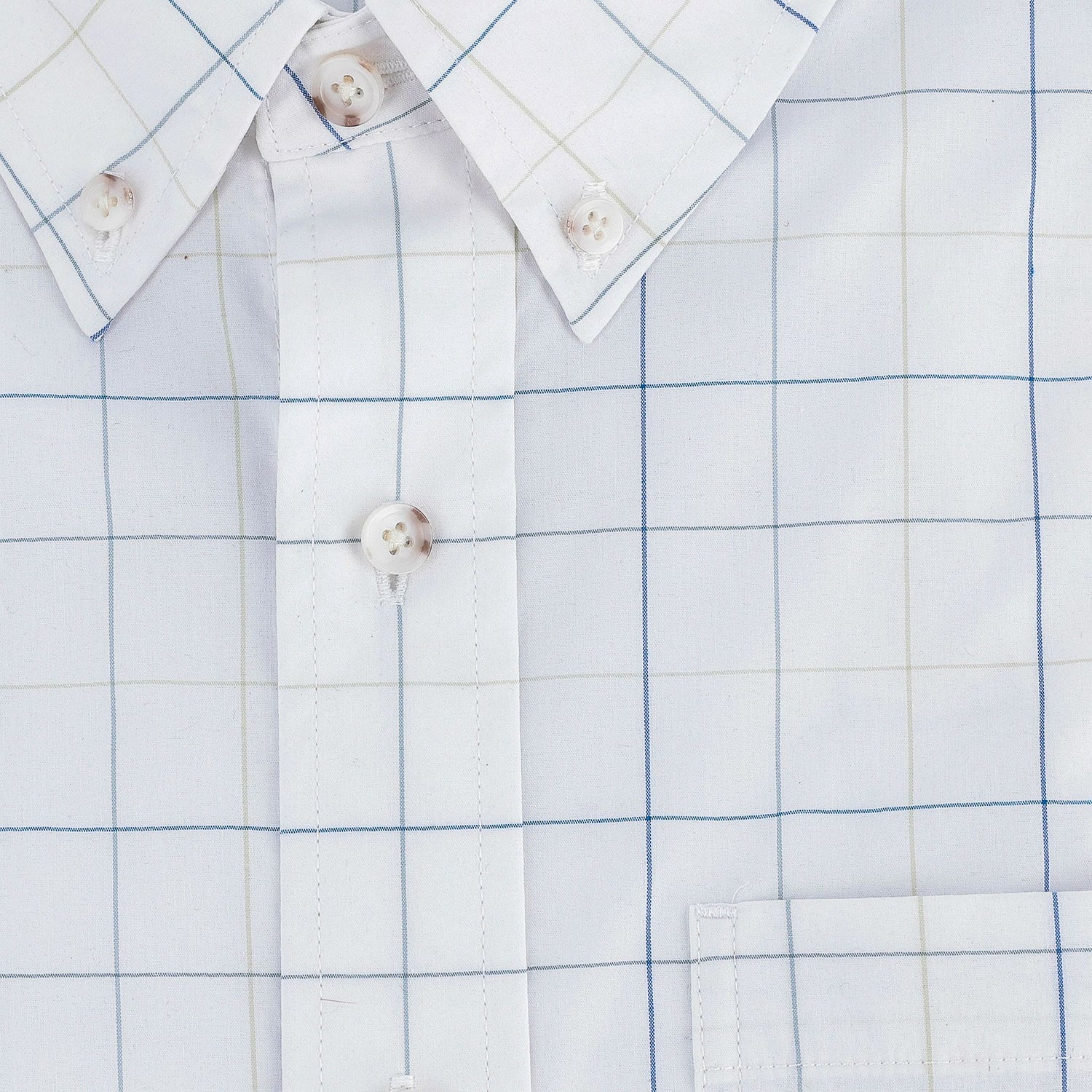 Close-up of the Tom Beckbe Powell Performance Shirt with a blue and beige grid, buttons, collar, and chest pocket.