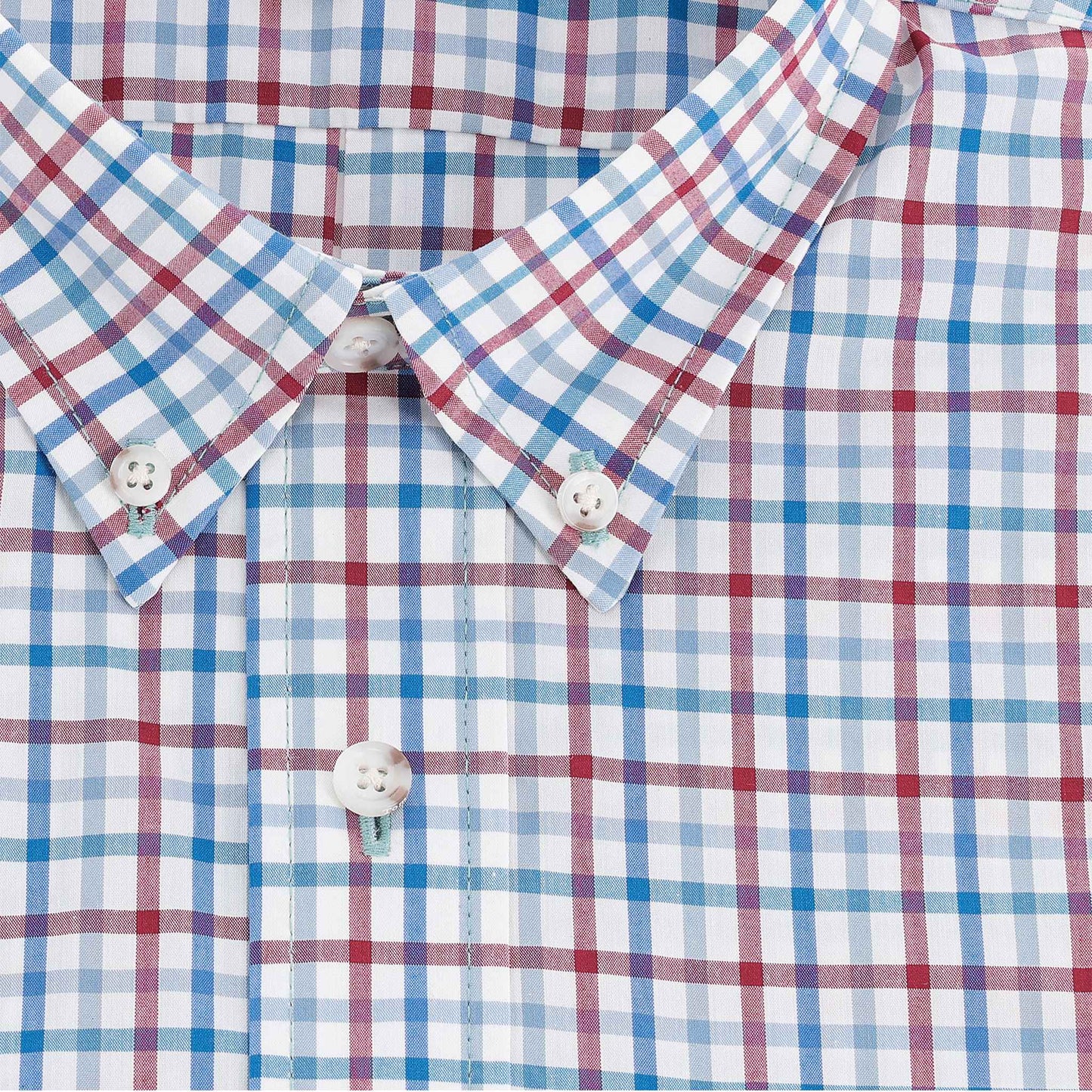 Close-up of the Tom Beckbe Powell Performance Shirt (Short Sleeve) with red, blue, and white checks and white buttons.