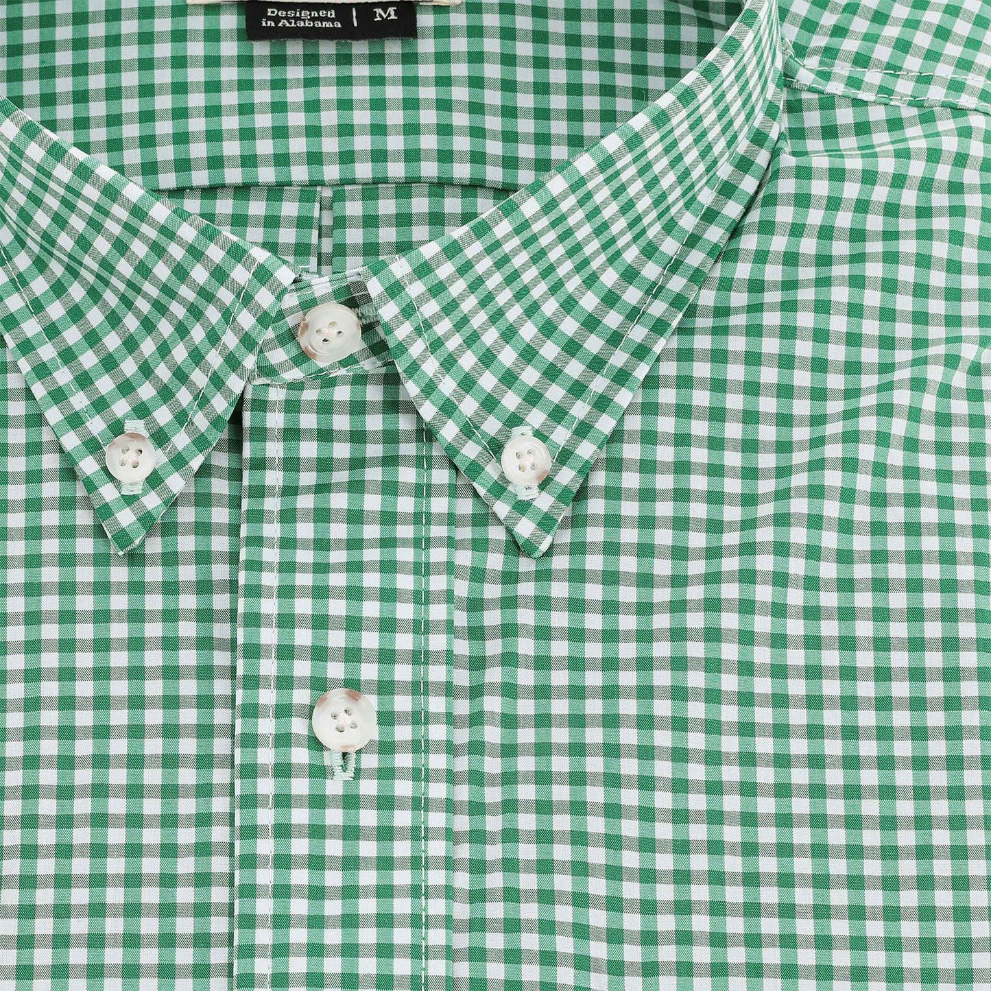Close-up of the Tom Beckbe Powell Performance Shirt (Short Sleeve) in green and white check with white buttons and a collar.