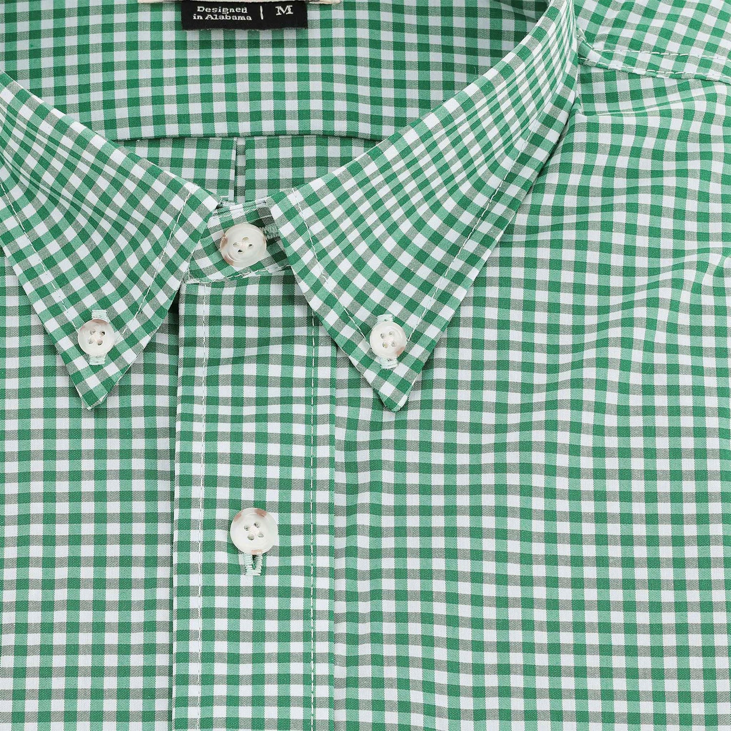 Close-up of the Tom Beckbe Powell Performance Shirt (Short Sleeve) in green and white check with white buttons and a collar.