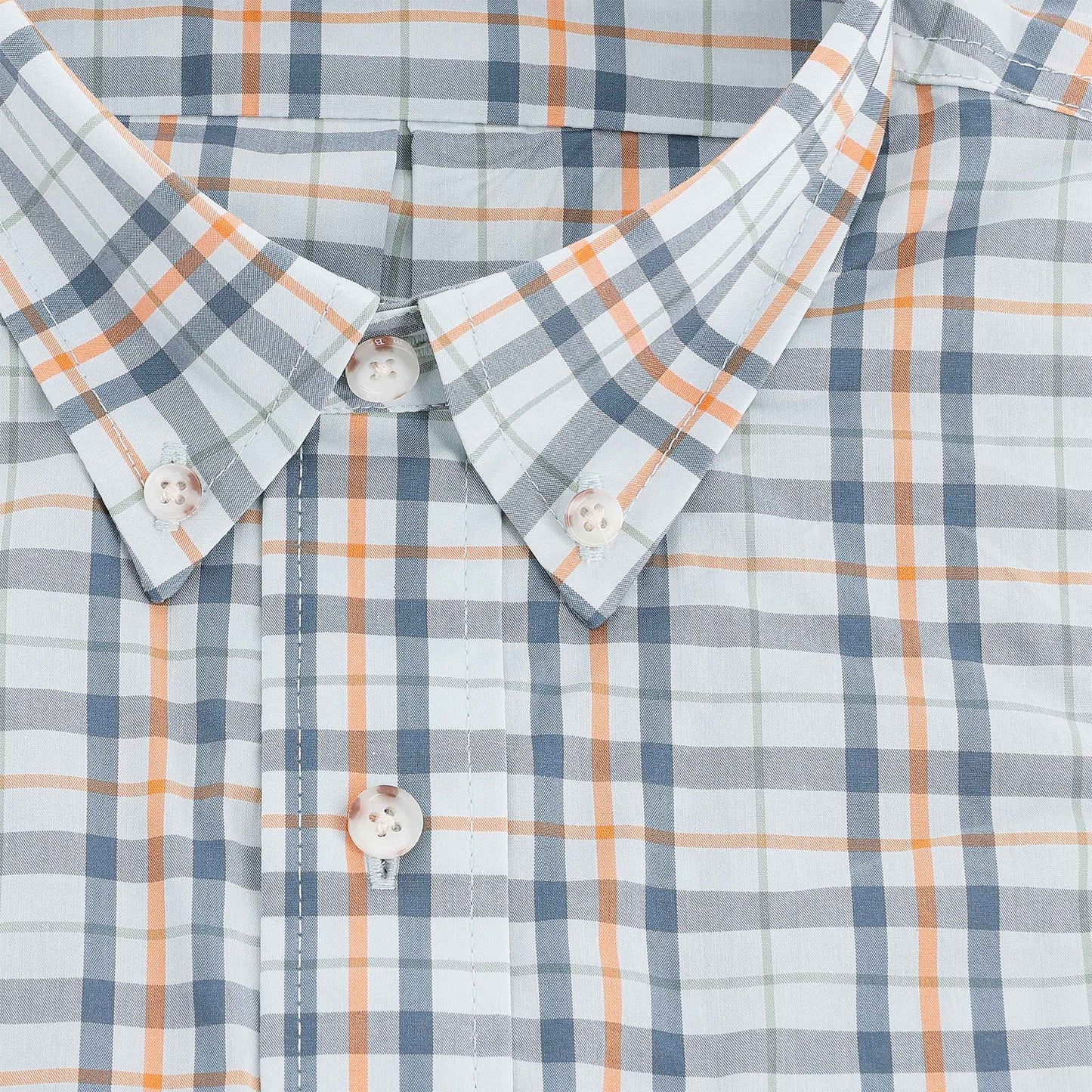 Close-up of the Tom Beckbe Powell Performance Shirt, short sleeve with blue, orange, and white plaid and white buttons.