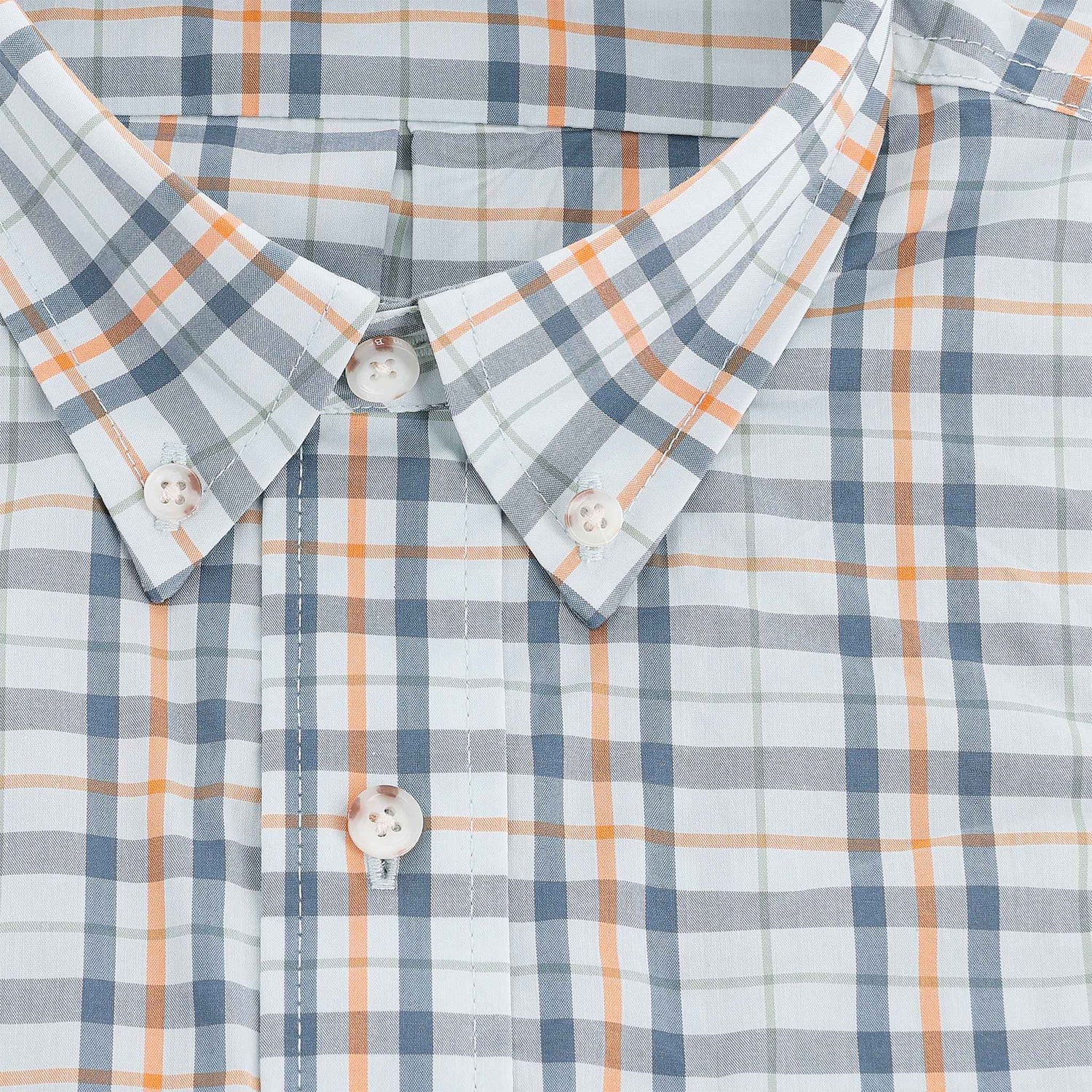 Close-up of the Tom Beckbe Powell Performance Shirt, short sleeve with blue, orange, and white plaid and white buttons.