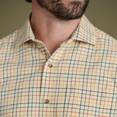 A close-up of the Tom Beckbe Prescott Estate Twill Shirt in yellow plaid, showcasing its collar—ideal for fall style.